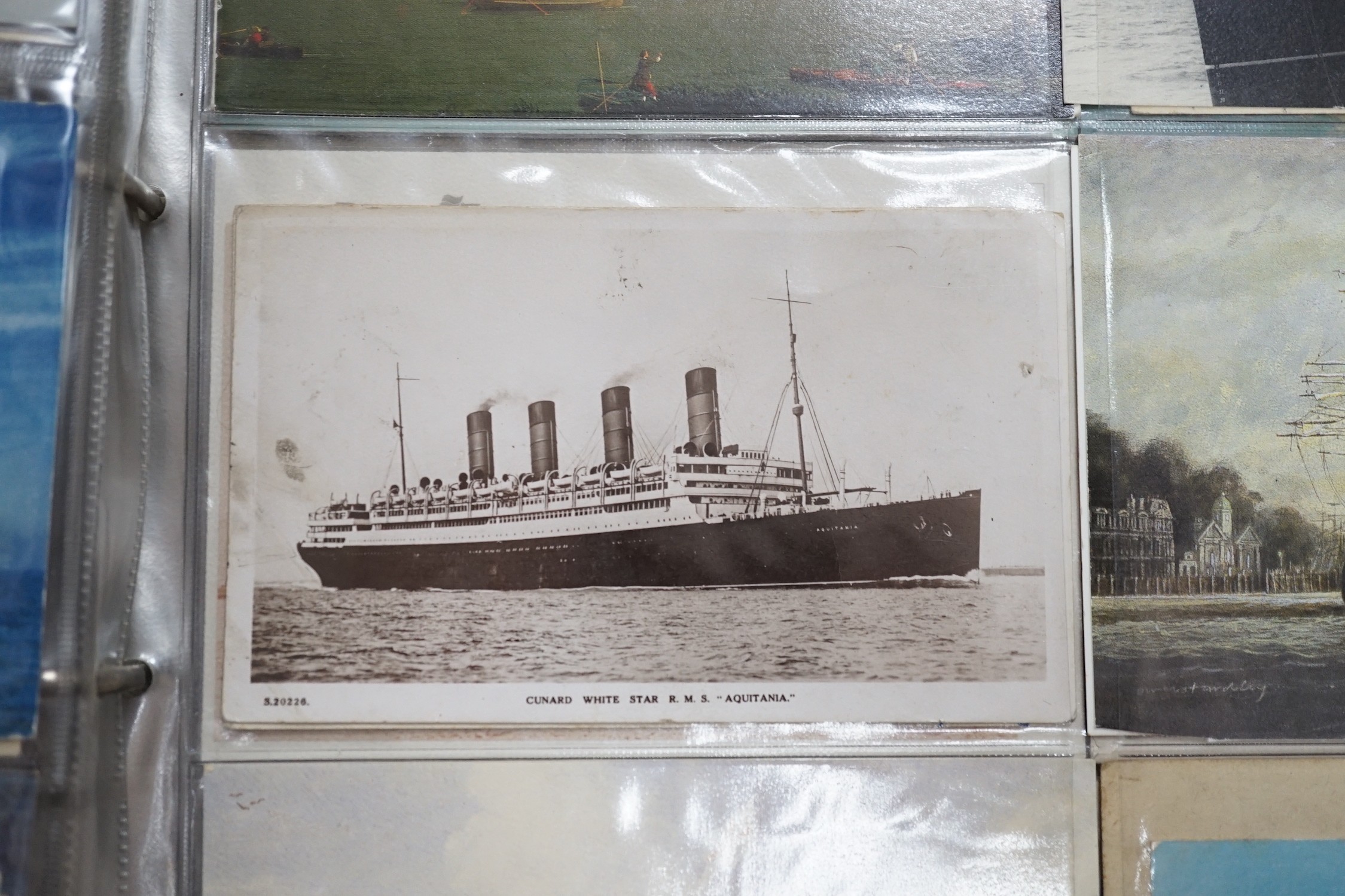 Three postcard albums with postcards relating to ships, royalty, art, trains, buses, motorcycles etc